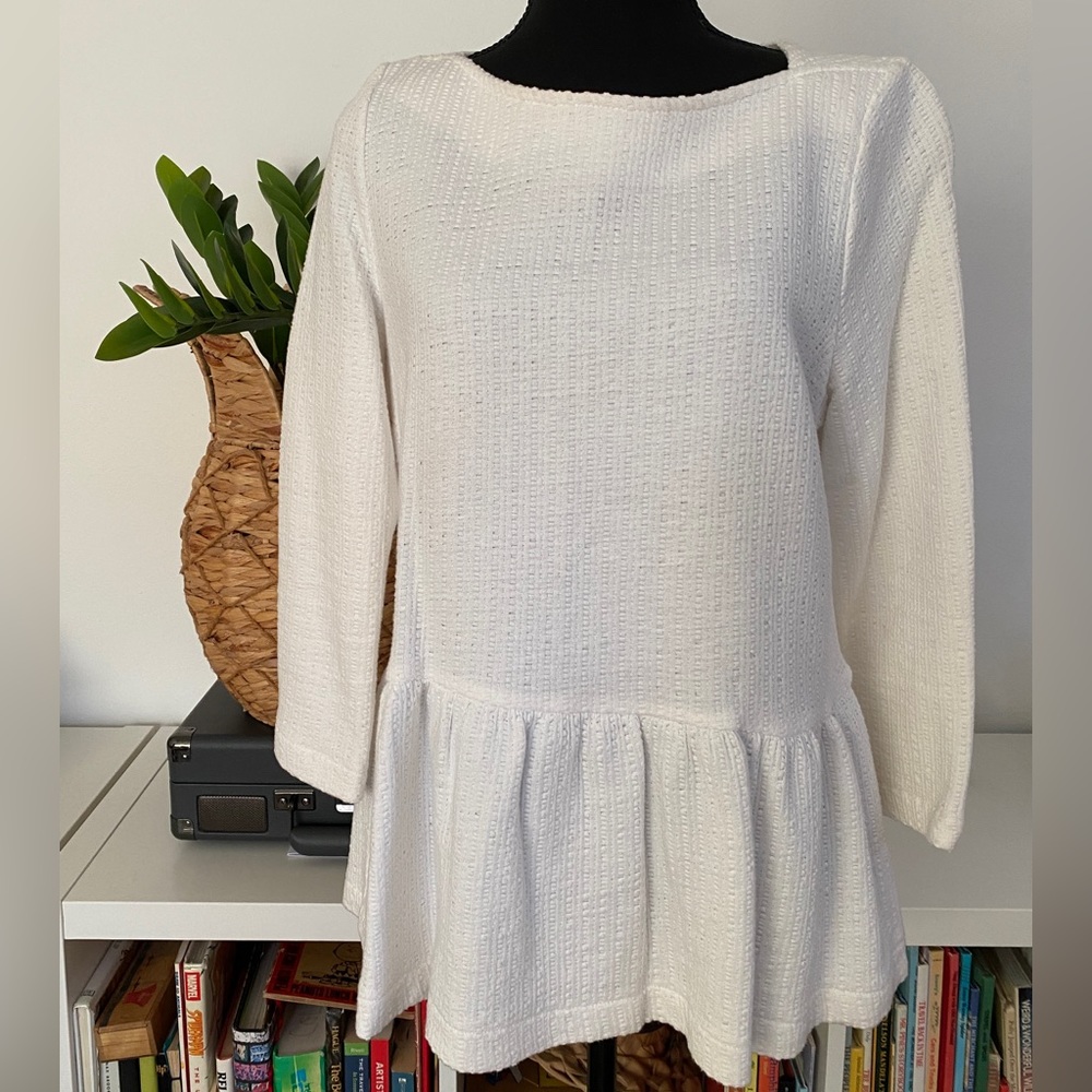 White peplum top with textured/puckered jersey fabric. Anthropologie size M.